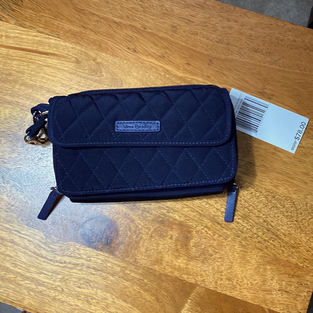 All in One Crossbody (for iPhone 6) classic navy color. Brand new with tags.